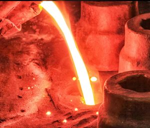 Melting Metal into castings to show What Is Green Sand Casting And Its Advantages