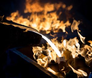 Melting Metal to show What Is Green Sand Casting And Its Advantages